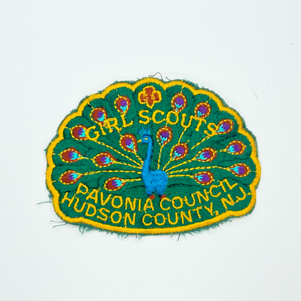 Celebrate Girl Scout heritage with this authentic vintage Pavonia Council patch from Hudson County, New Jersey. The striking peacock design served as the council's proud symbol, representing the organization's values and spirit. 
