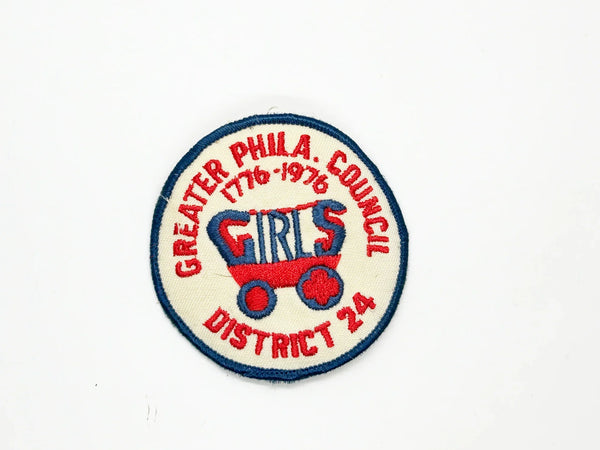 This vintage Greater Phila. Girls Council District 24 patch from the American Bicentennial period features the dates "1776-1976" embroidered in red along the top curve, commemorating the 200th anniversary of American independence. 