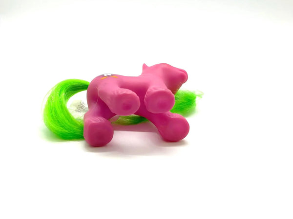 This is a vintage "Baby Waddles" My Little Pony , G1 figure , specifically part of the "Playtime Baby Brother Ponies" set released by Hasbro in 1988-1989