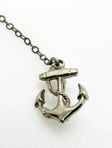 Step back in time with this charming vintage brooch set!! This whimsical dual brooch features a meticulously crafted sailing ship elegantly connected by a gleaming chain to a sturdy anchor. The intricate details and silver-tone finish are truly captivating, making this piece a delightful find for any vintage jewelry enthusiastt