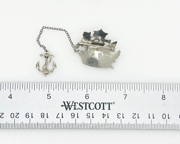 Step back in time with this charming vintage brooch set!! This whimsical dual brooch features a meticulously crafted sailing ship elegantly connected by a gleaming chain to a sturdy anchor. The intricate details and silver-tone finish are truly captivating, making this piece a delightful find for any vintage jewelry enthusiast