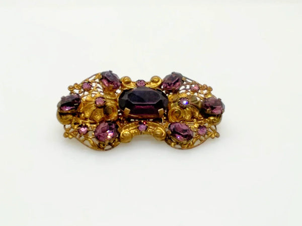 Dazzling 1930s Czech Purple Glass Filigree Brooch - Experience exquisite filigree craftsmanship with vibrant purple stones. Timeless vintage charm. Shop now!