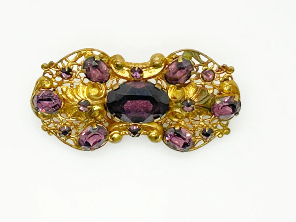 Dazzling 1930s Czech Purple Glass Filigree Brooch - Experience exquisite filigree craftsmanship with vibrant purple stones. Timeless vintage charm. Shop now!