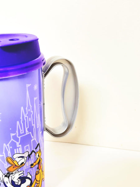 Walt Disney World 100th Anniversary Resort Refillable Tumbler Cup Mug featuring a vibrant purple design, released in 2023 for the "100 Years of Wonder" celebration. 
