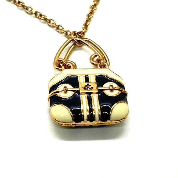 Take your your accessory game to the next level with this enchanting vintage purse necklace, a miniature work of art that celebrates timeless style.