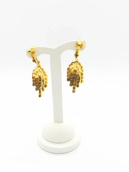 Bright red sparkling round rhinestones glitter in a gold tone setting. They give Art Deco vibes while being easy to wear and fun. They each measures 2" long and are in near mint condition, with hinge backs.