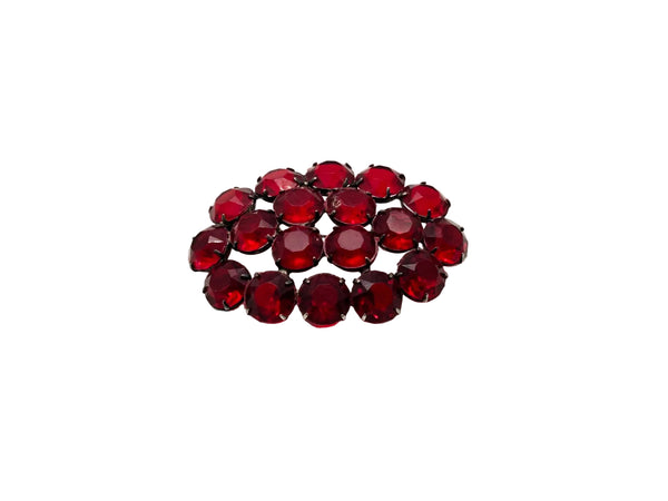 A cluster of round, faceted deep red rhinestones arranged in a small cluster on a plain white background.