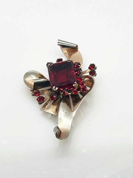 Mid Century Sterling Statement Brooch with Vivid Red Stones - Make a dramatic statement with this vintage brooch featuring a brilliant ruby red center stone. Shop now!