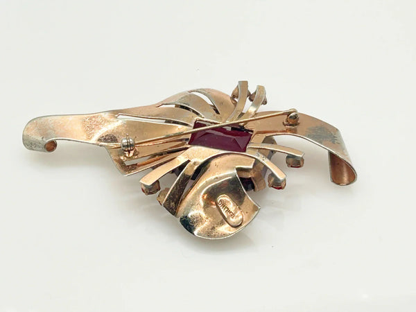 Mid Century Sterling Statement Brooch with Vivid Red Stones - Make a dramatic statement with this vintage brooch featuring a brilliant ruby red center stone. Shop now!