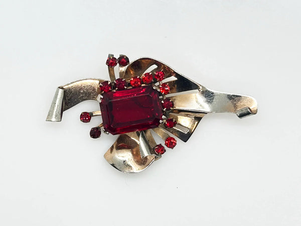Mid Century Sterling Statement Brooch with Vivid Red Stones - Make a dramatic statement with this vintage brooch featuring a brilliant ruby red center stone. Shop now!