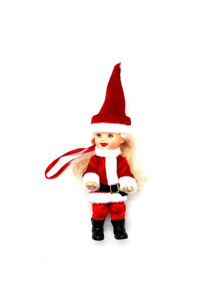 The 2003 Mattel Barbie Kelly Club Santa Claus ornament doll (Model #B1347) is a 4 to 5-inch collectible fashion doll featuring blonde hair and blue eyes.