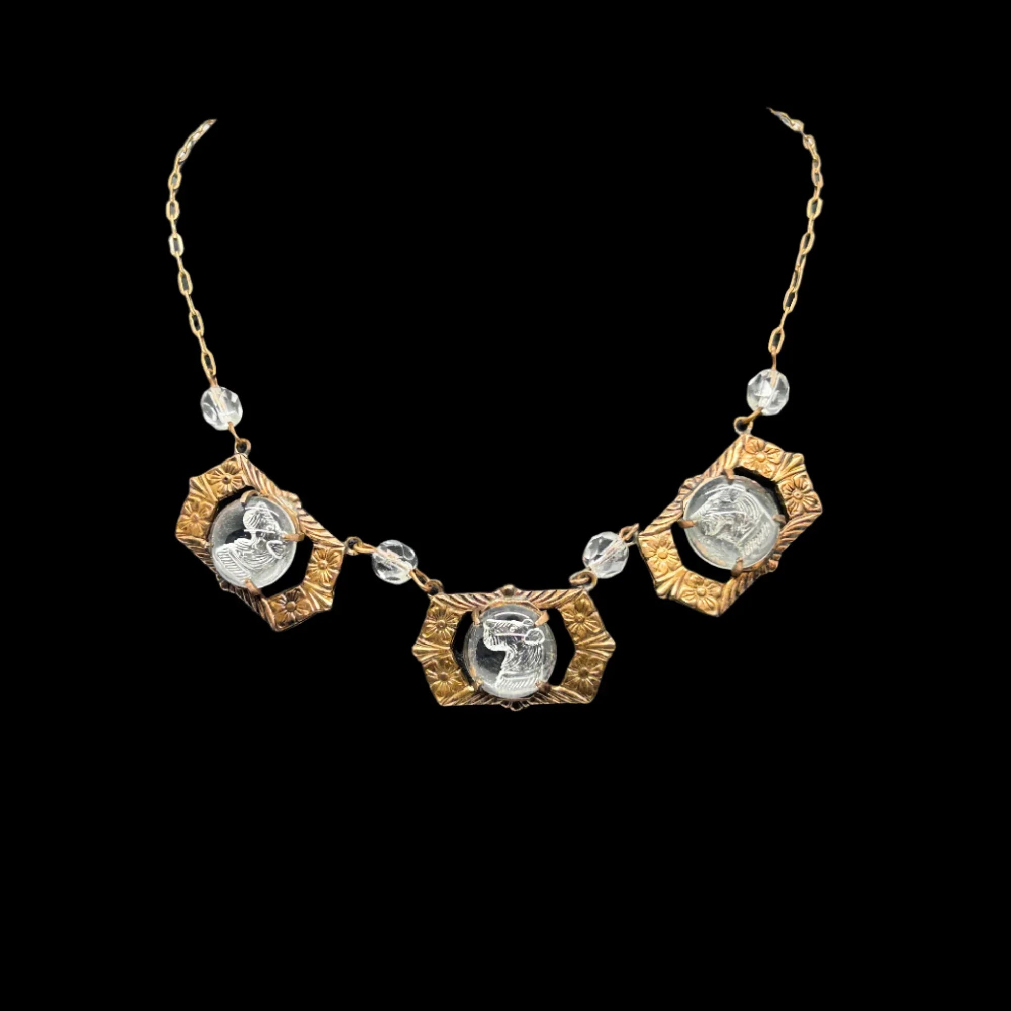 Indulge in the timeless charm of our Vintage Necklace with Clear Carved Scottie Links. This one-of-a-kind piece features three delicately carved panels showcasing the profile of a beloved terrier or Schnauzer