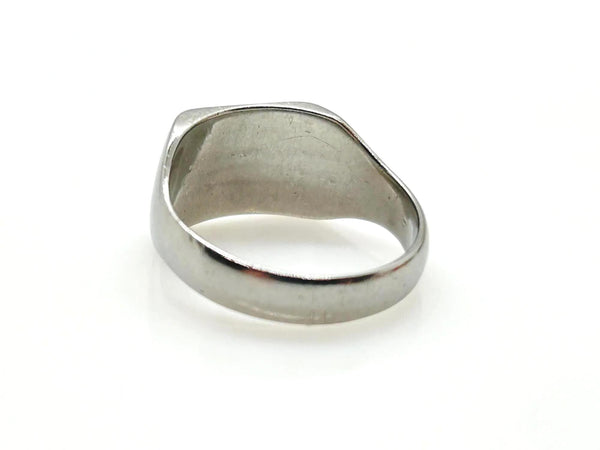 A polished silver signet ring with a wide, flat face and a slightly tapered band, shown on a plain white background.