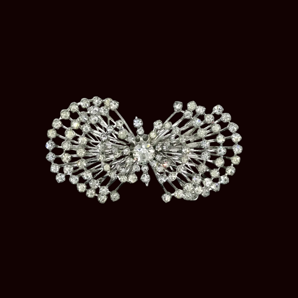 Perfect for vintage jewelry lovers: our Sparkling Vintage Atomic Silvertone Rhinestone Pin provides layered brilliance and a unique, eye-catching look. Shop today!