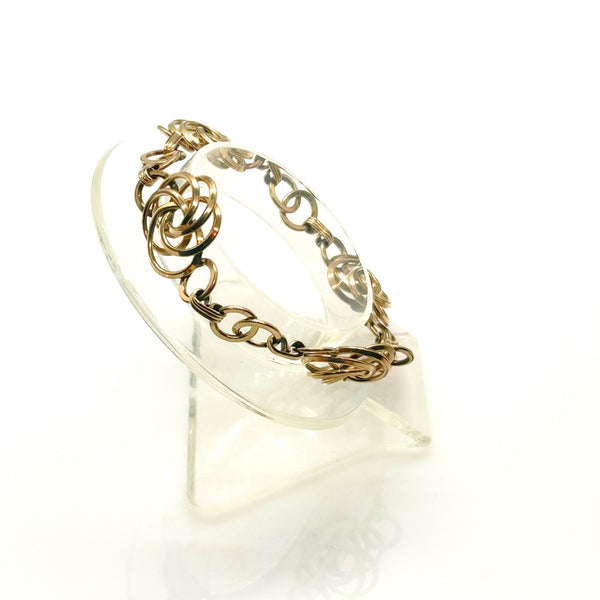 Vintage Gold Tone Multi-Ring Swirl Love Knot Bracelet & Screw Back Earrings Demi Parure Set