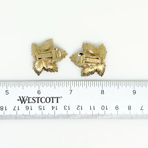 Indulge in the enchanting allure of nature with these exquisite leaf earrings, meticulously crafted from lustrous green jade and exquisitely embellished with delicate faux pearls. These captivating earrings boast comfortable clip-on backs, measuring a graceful 1.5 inches, and are securely fastened with robust hinge closures