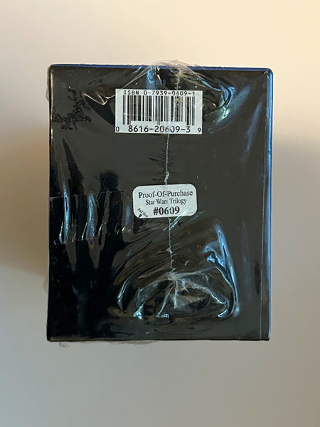 Back of a factory-sealed 1995 Star Wars Trilogy VHS box set showing the barcode and a white "Proof-Of-Purchase Star Wars Trilogy #0609" sticker over the shrink-wrap seam. The top label displays ISBN 0-7939-0609-1 and barcode number 0 8616-20609-3 9