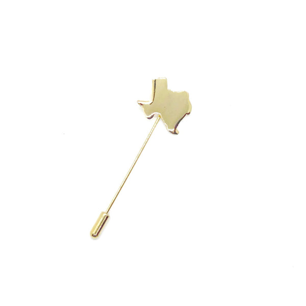 Gold-tone Texas state-shaped stickpin from the 1970s, featuring a polished silhouette mounted on a secure needle with protective clutch. Measures 2.5" excluding cap. Vintage lapel pin or tie tack perfect for adding Texas pride to any outfit.