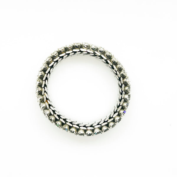 Sparkle up your vintage jewelry collection with this stunning three-row rhinestone bracelet expansion bracelet. Crafted in the classic style beloved from the 1940s through 1960s, this piece showcases brilliant clear glass rhinestones secured in a flexible silver-tone metal band. 