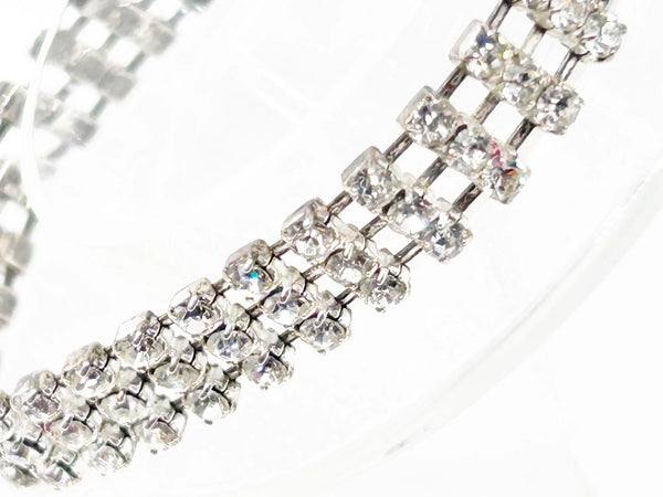 Perfect for vintage bracelet lovers: our Stunning Vintage Three Row Rhinestone Bracelet provides refined sophistication with bright stones and secure fit. Shop today!