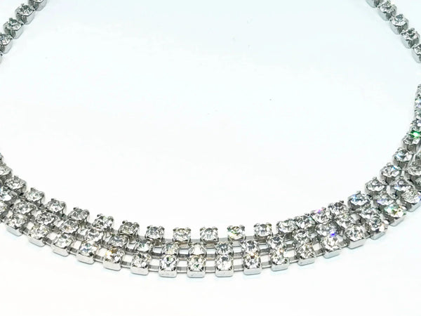 Make your everyday or evening look extra glamorous with this dazzling classic vintage rhinestone choker. The approximately 15" long choker boasts a convenient hook clasp, allowing for a customized and comfortable fit.