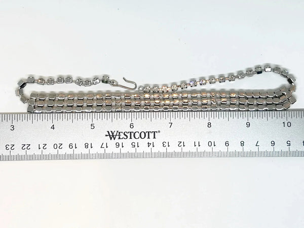 Make your everyday or evening look extra glamorous with this dazzling classic vintage rhinestone choker. The approximately 15" long choker boasts a convenient hook clasp, allowing for a customized and comfortable fit.