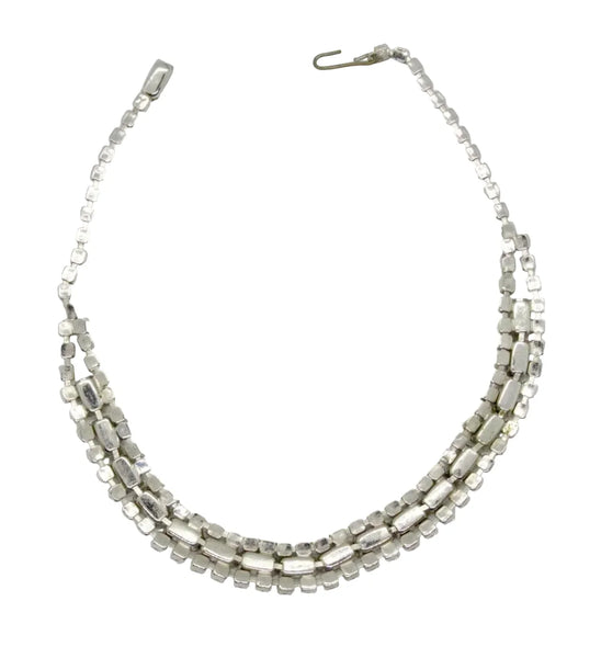 This is a beautiful vintage rhinestone necklace or choker set with a line of sideways baguettes in black paired with meticulously prong-set round white rhinestones on top and bottom.