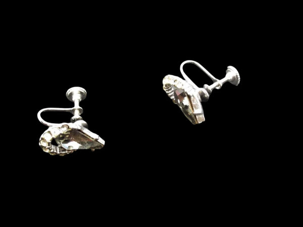 Get ready to shine with these stunning earrings from Weiss! Made with beautiful gray teardrop rhinestones, accented with sparkling clear round rhinestones, and set in high-quality silvery metal, these earrings are sure to make a statement. 